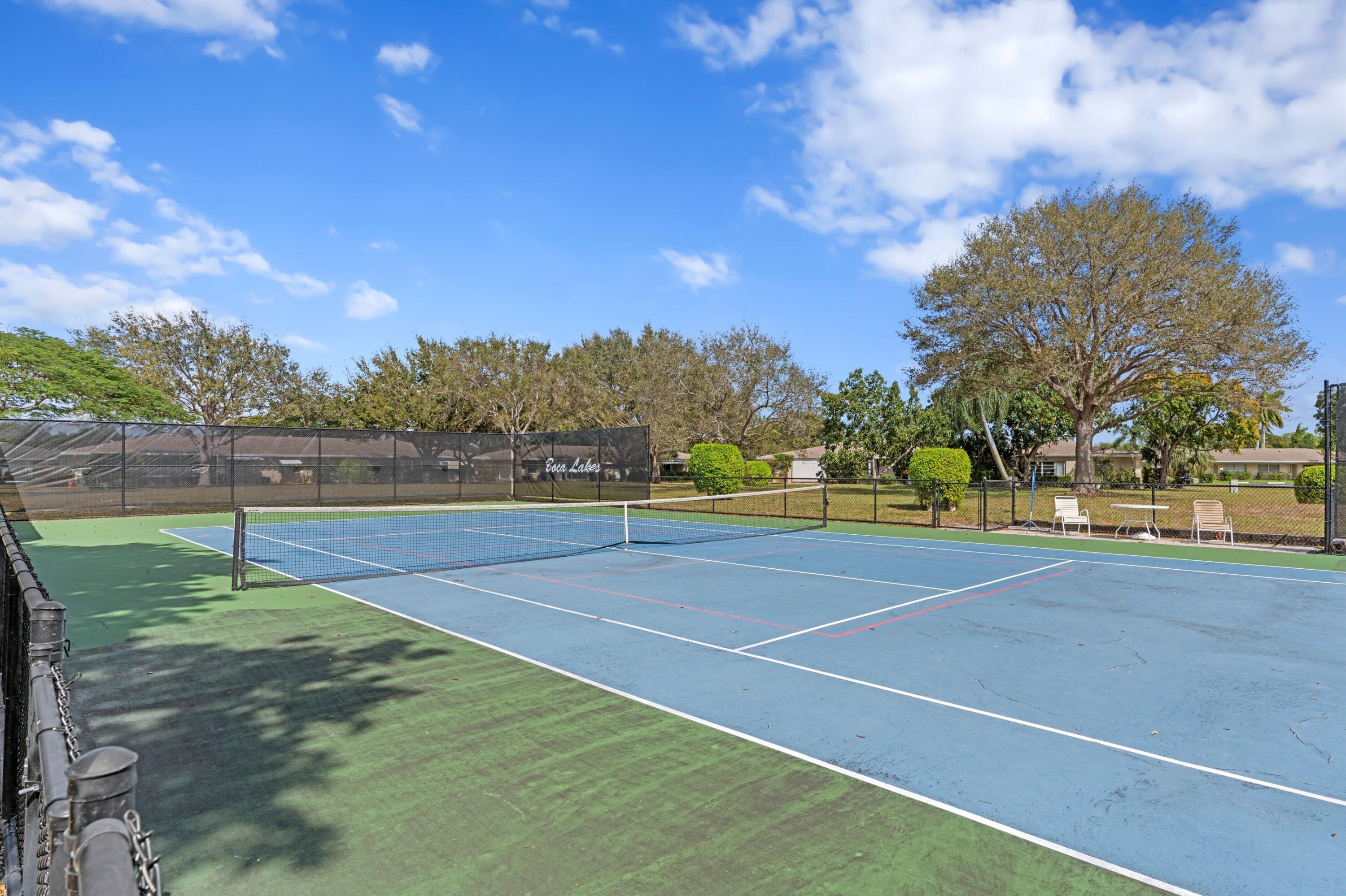 8555 Bella Vista Drive, Unit 86 Boca Raton, FL 33433 - Photo 21 of 48 a view of yard tennis court