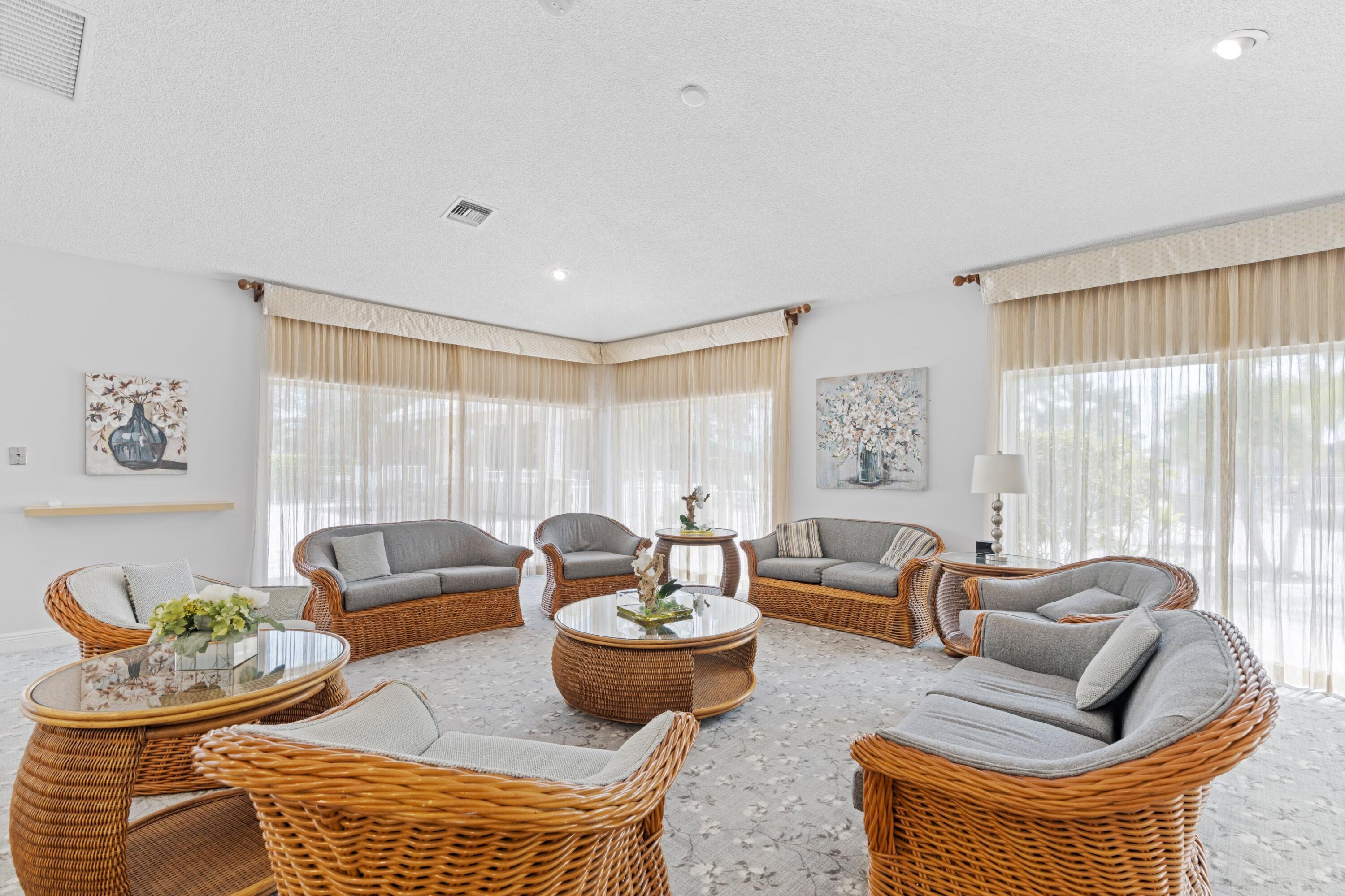 8555 Bella Vista Drive, Unit 86 Boca Raton, FL 33433 - Photo 23 of 48 a living room with furniture and a large window