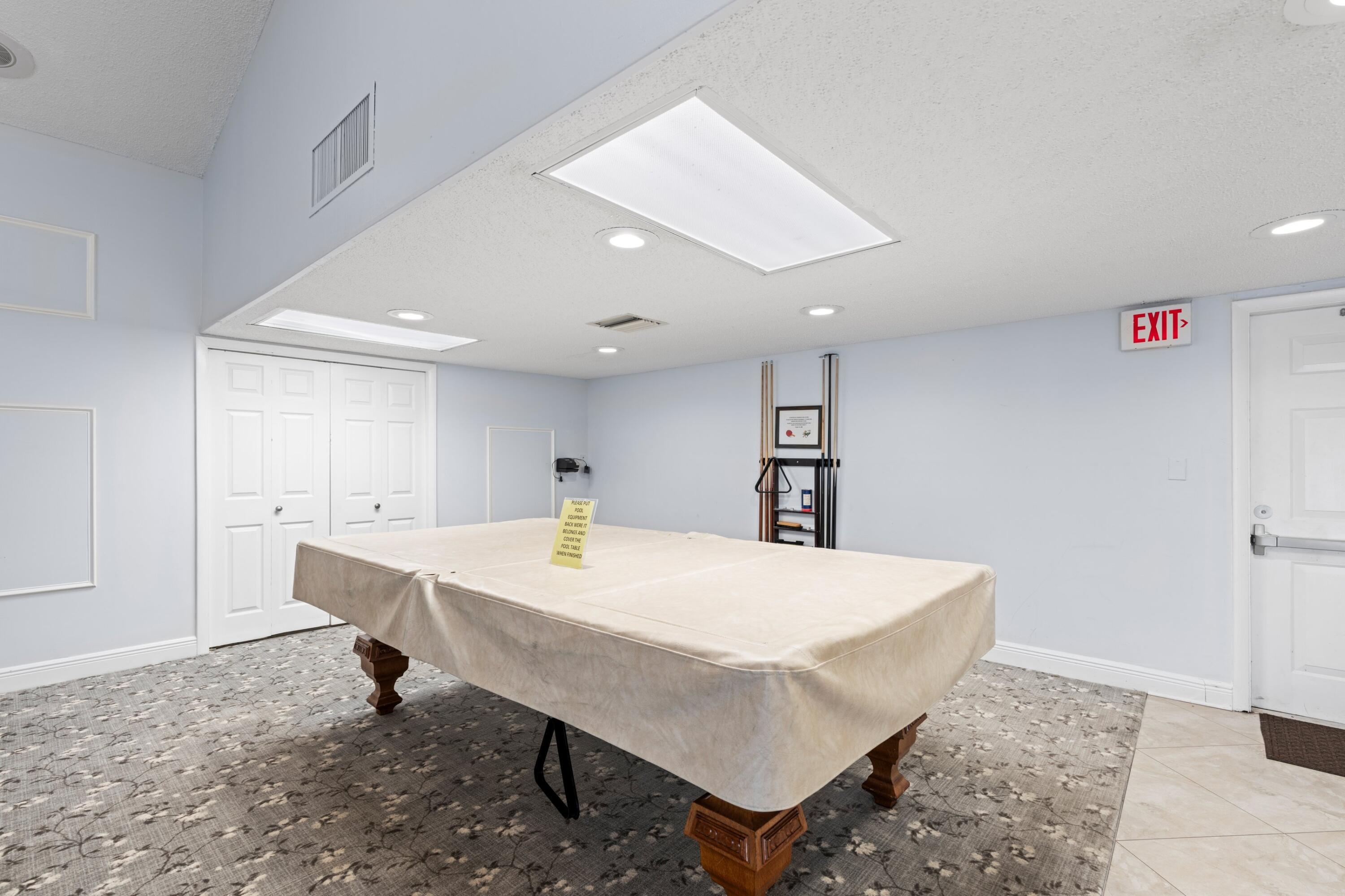 8555 Bella Vista Drive, Unit 86 Boca Raton, FL 33433 - Photo 26 of 48 a view of kitchen with a table and chairs