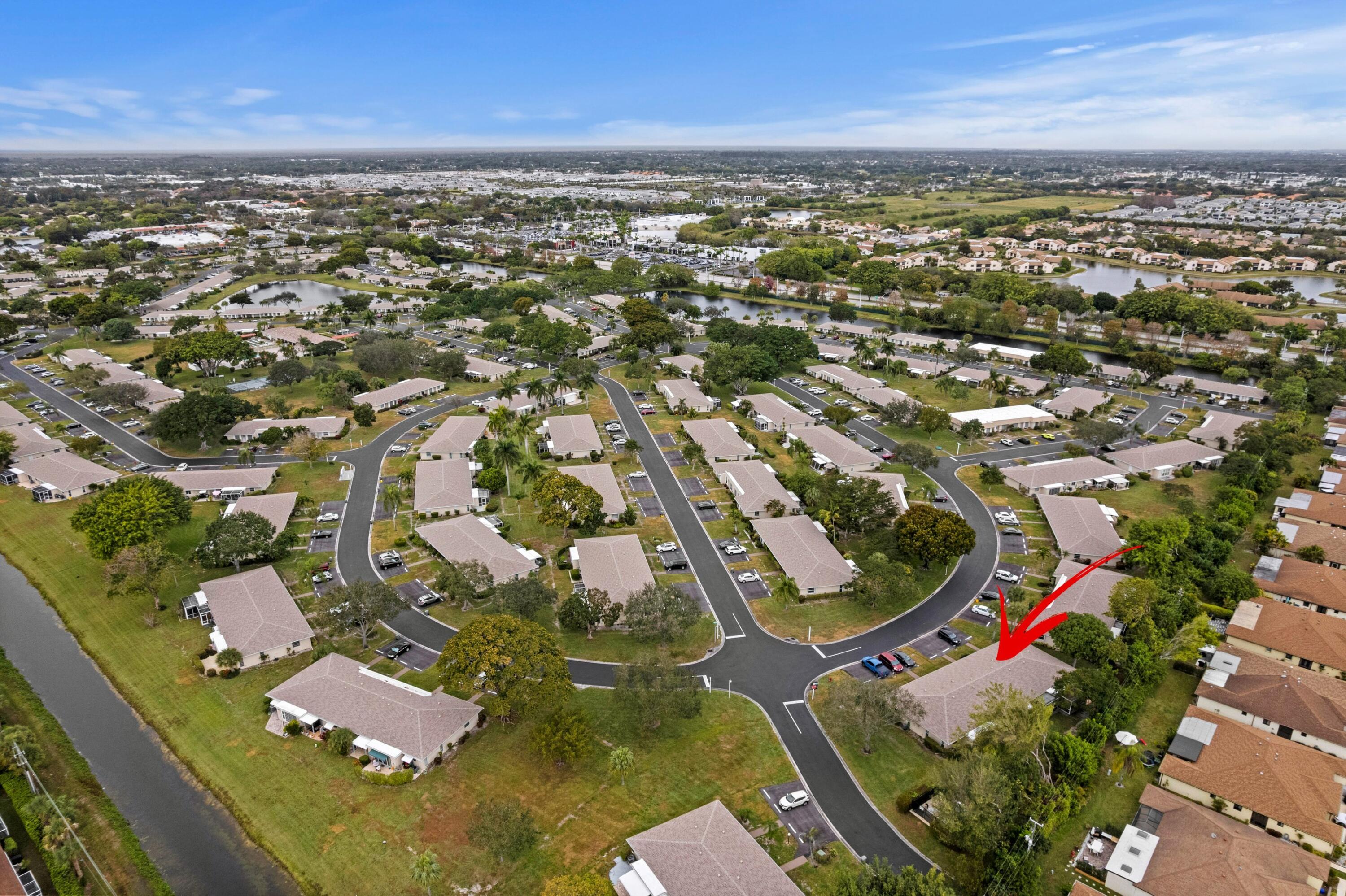 8555 Bella Vista Drive, Unit 86 Boca Raton, FL 33433 - Photo 29 of 48 an aerial view of residential houses with outdoor space