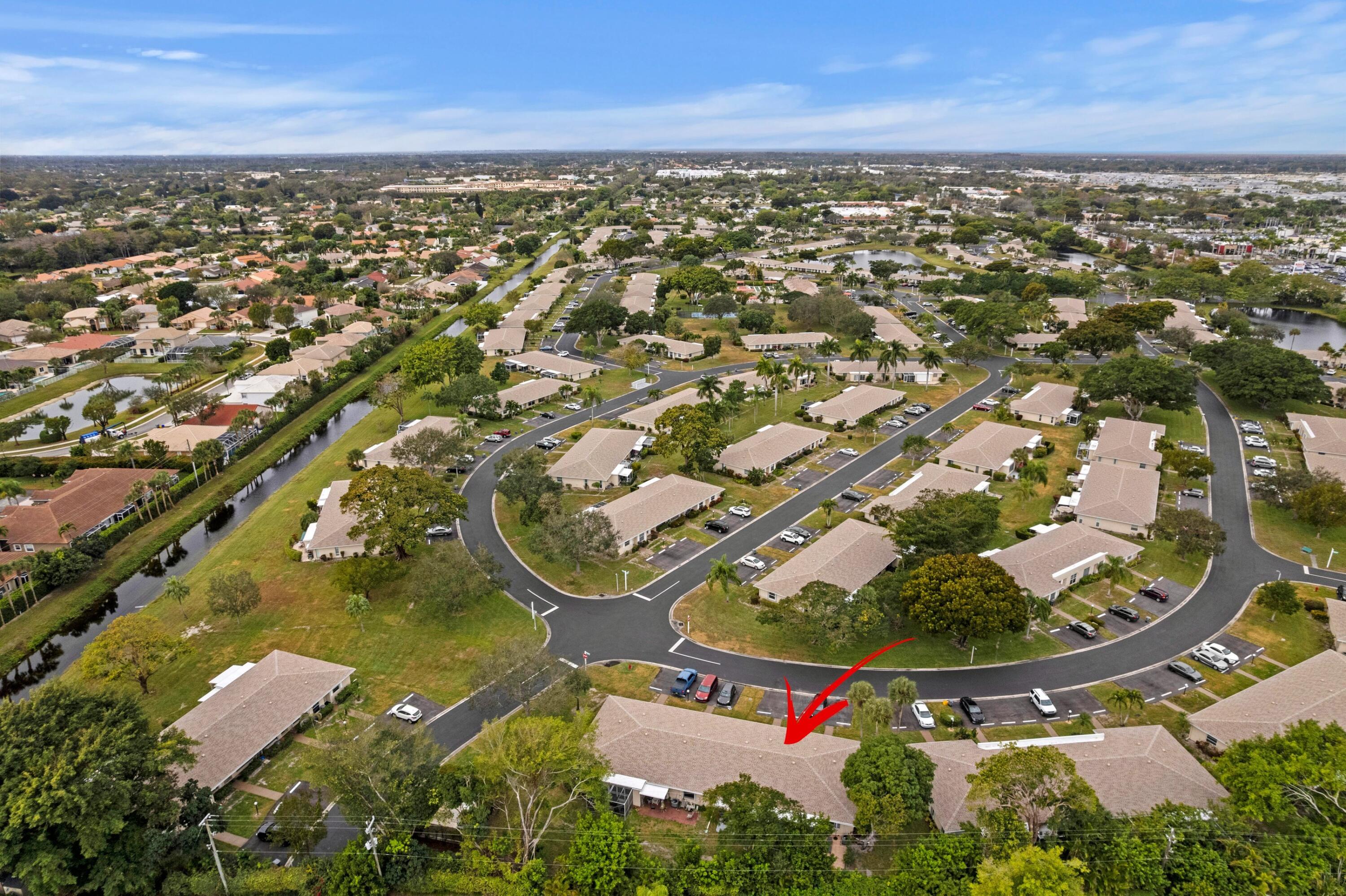 8555 Bella Vista Drive, Unit 86 Boca Raton, FL 33433 - Photo 3 of 48 an aerial view of residential houses with outdoor space