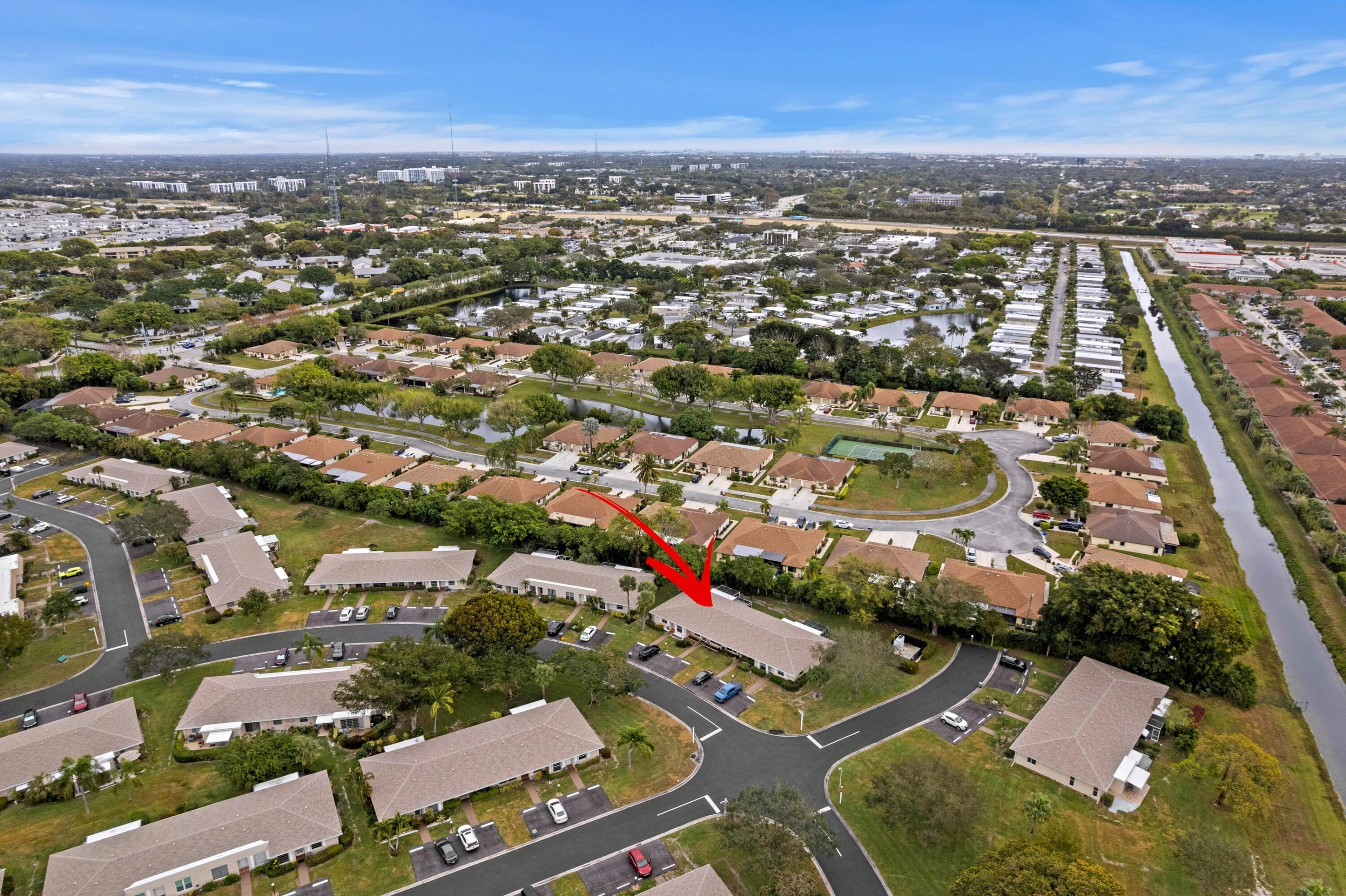 8555 Bella Vista Drive, Unit 86 Boca Raton, FL 33433 - Photo 31 of 48 an aerial view of residential houses with city view
