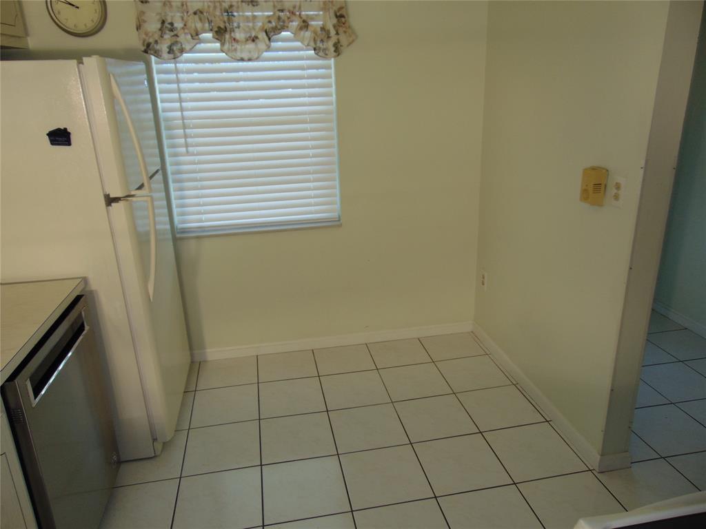 9788 Marina Boulevard, Unit 313 Boca Raton, FL 33428 - Photo 21 of 70 EAT IN KITCHEN. KITCHEN - AID DISHWASHER STAINLESS STEEL INSIDE AND OUT. WHITE TILE FLOORING IN KITCHEN, FOYER AND HALL TO GUEST SUITE.