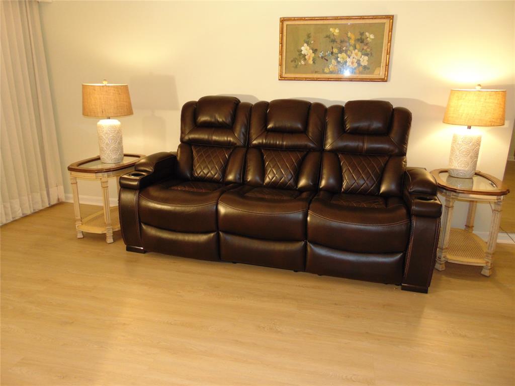 9788 Marina Boulevard, Unit 313 Boca Raton, FL 33428 - Photo 36 of 70 a living room with furniture and a lamp