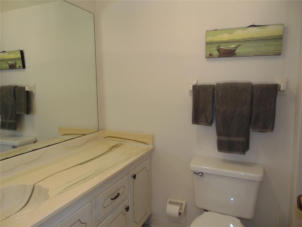 9788 Marina Boulevard, Unit 313 Boca Raton, FL 33428 - Photo 45 of 70 a bathroom with a sink and a toilet