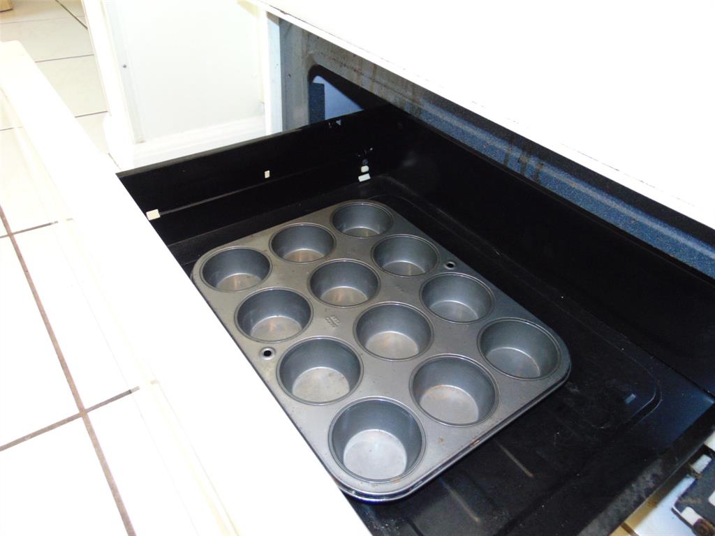 9788 Marina Boulevard, Unit 313 Boca Raton, FL 33428 - Photo 57 of 70 a kitchen with a sink and cabinets