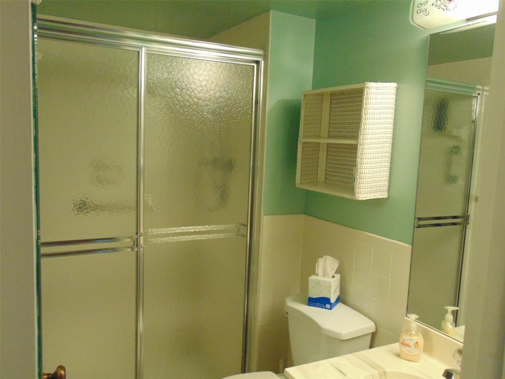 9788 Marina Boulevard, Unit 313 Boca Raton, FL 33428 - Photo 58 of 70 a bathroom with a shower and a toilet