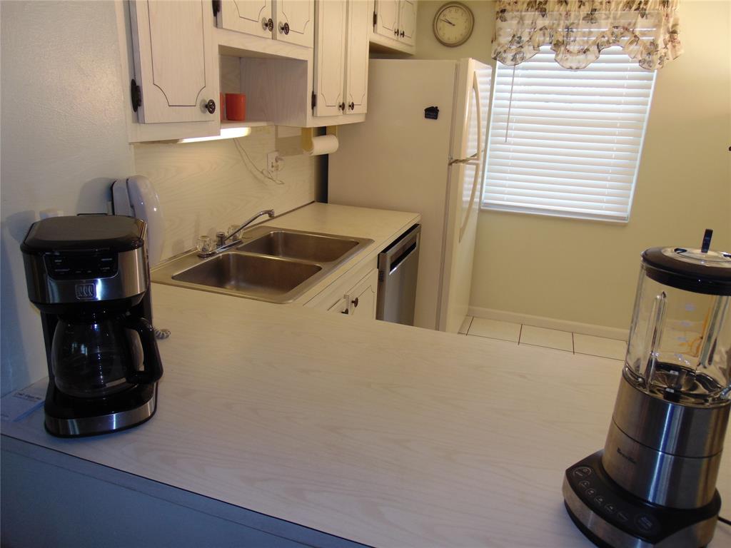 9788 Marina Boulevard, Unit 313 Boca Raton, FL 33428 - Photo 6 of 70 WIDE PASS THROUGH FROM DINING AREA TO EAT IN IITCHEN