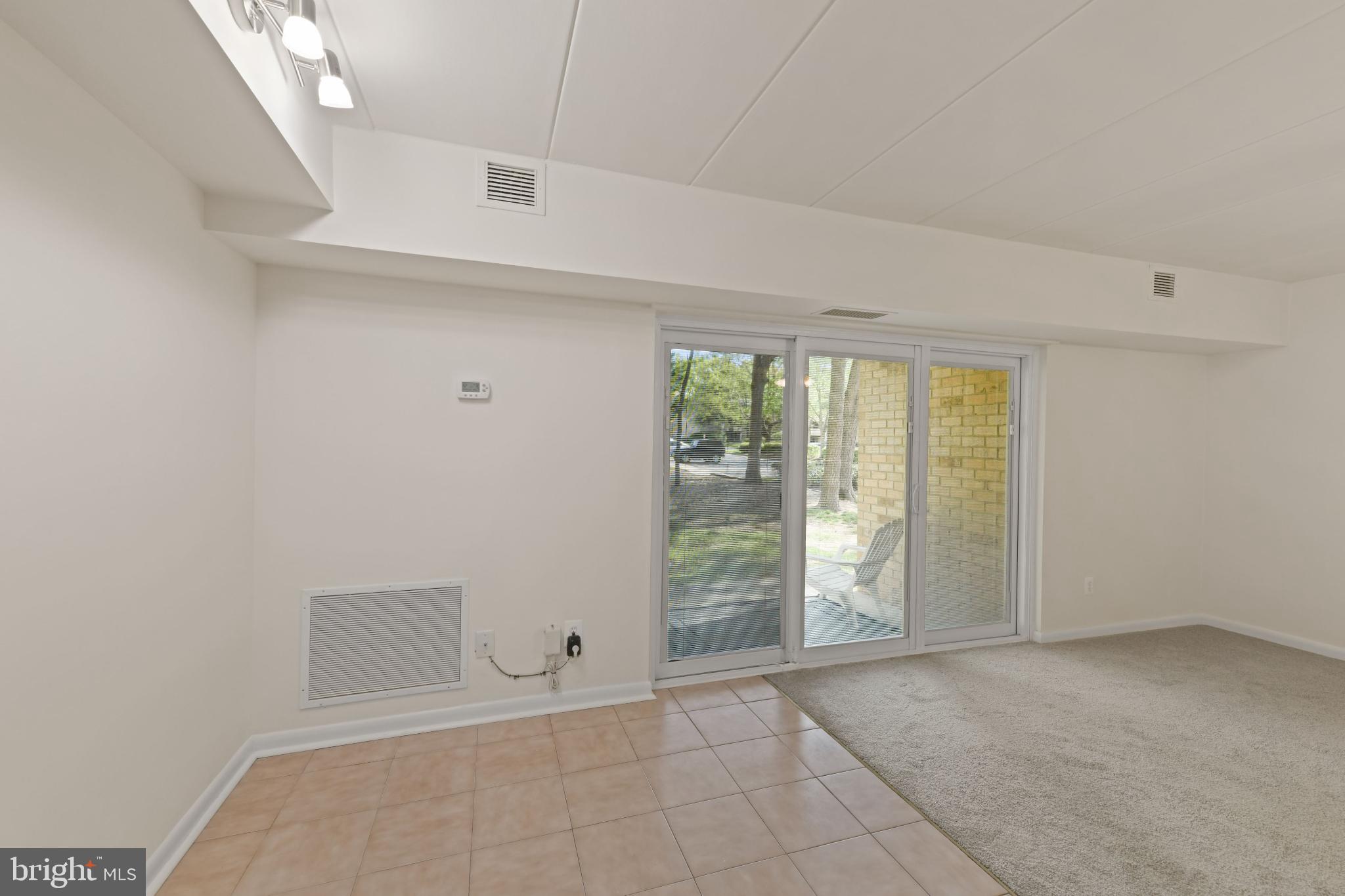 2326 Freetown Court, Unit 2B Reston, VA 20191 - Photo 13 of 21 Bright and airy space with outdoor access.