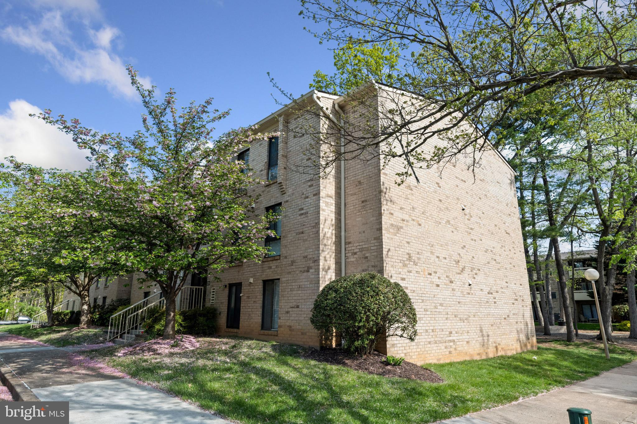 2326 Freetown Court, Unit 2B Reston, VA 20191 - Photo 2 of 21 Charming brick apartment nestled in greenery.