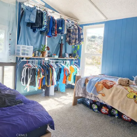 a bedroom with a bed and a table