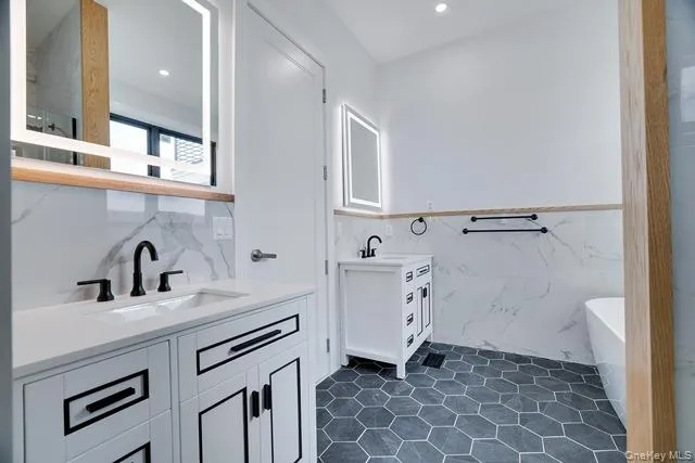 a bathroom with a sink toilet and mirror