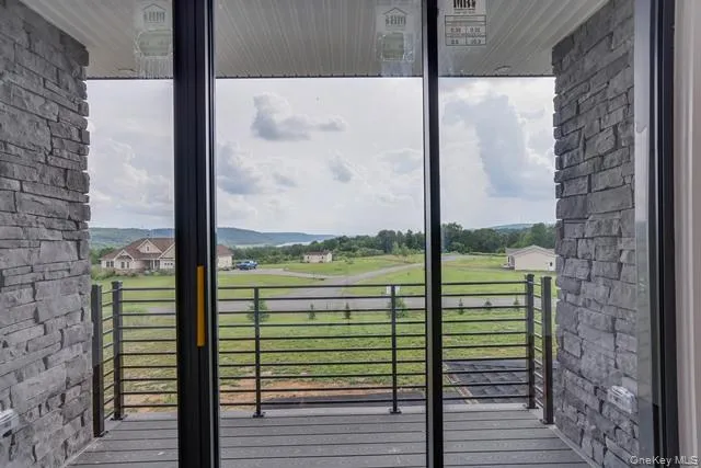 a view of a glass door and porch