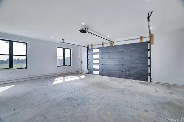 a view of an empty room with windows