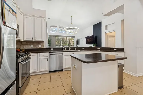 a kitchen with a appliances and cabinets