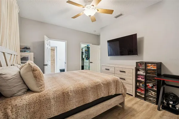 a bedroom with furniture and a window