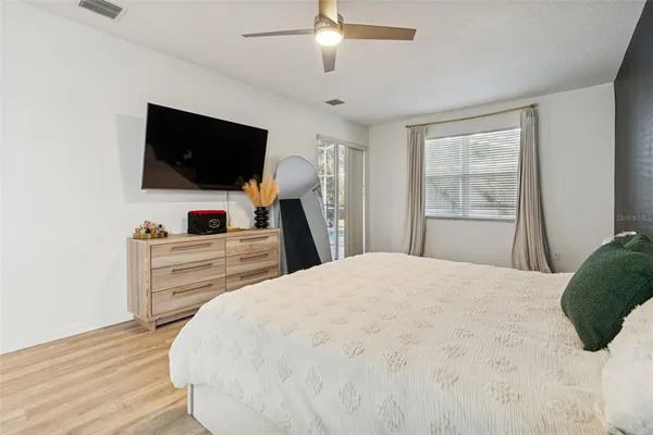 a large white kitchen with a large window