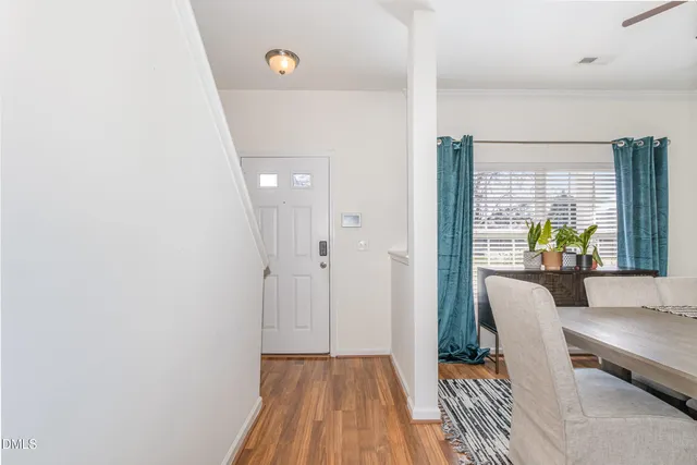 a view of kitchen with furniture and wooden floor