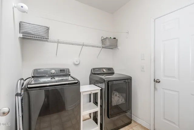 a view of storage and utility room with washer and dryer