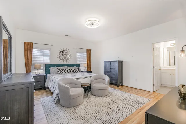 a bedroom with a bed and mirror