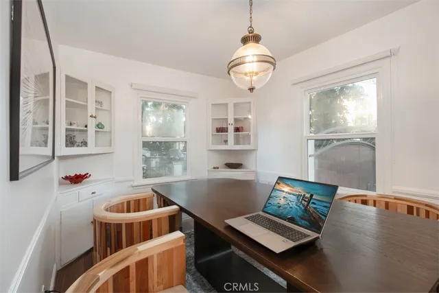 a kitchen with granite countertop stainless steel appliances a sink stove refrigerator and cabinets