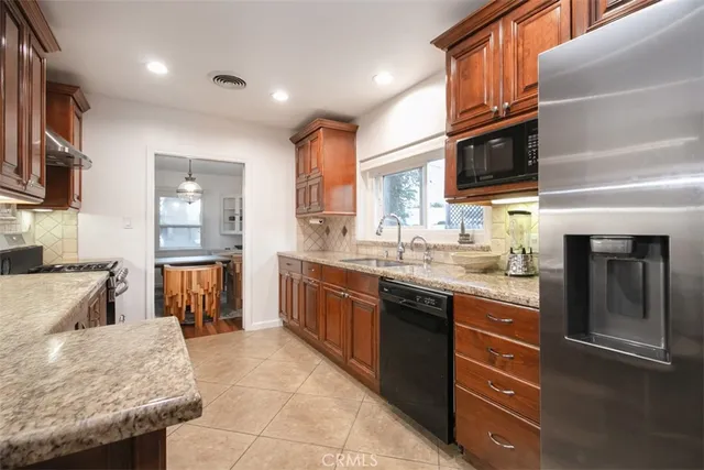 a bedroom with bed and wooden floor