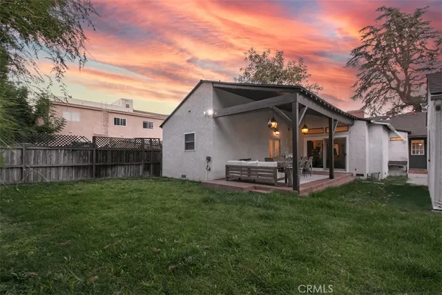 a swimming pool with outdoor seating and yard