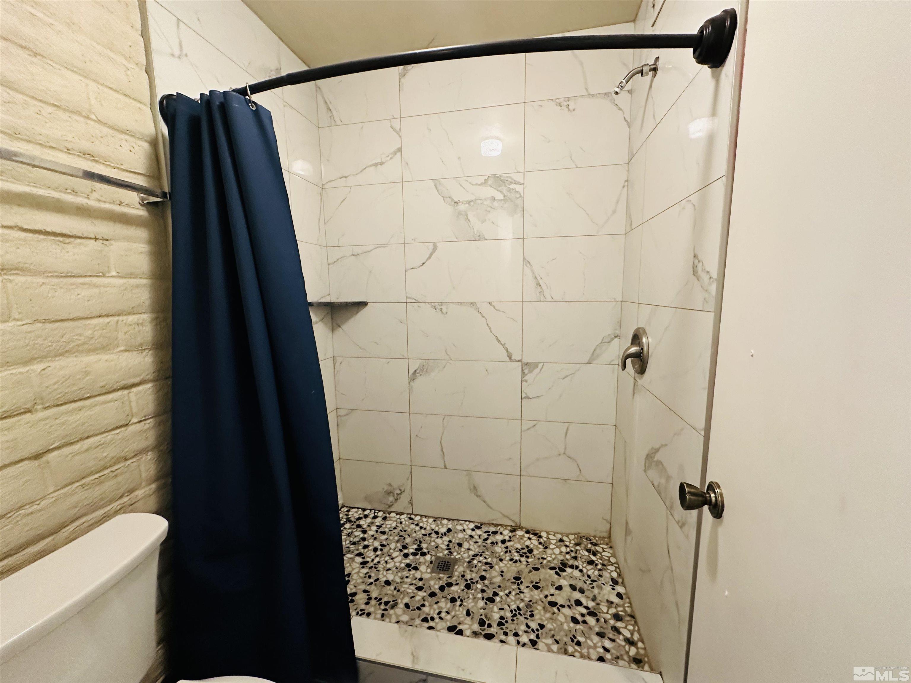 32 Castle Way Carson City, NV 89706 - Photo 11 of 16 a bathroom with a shower