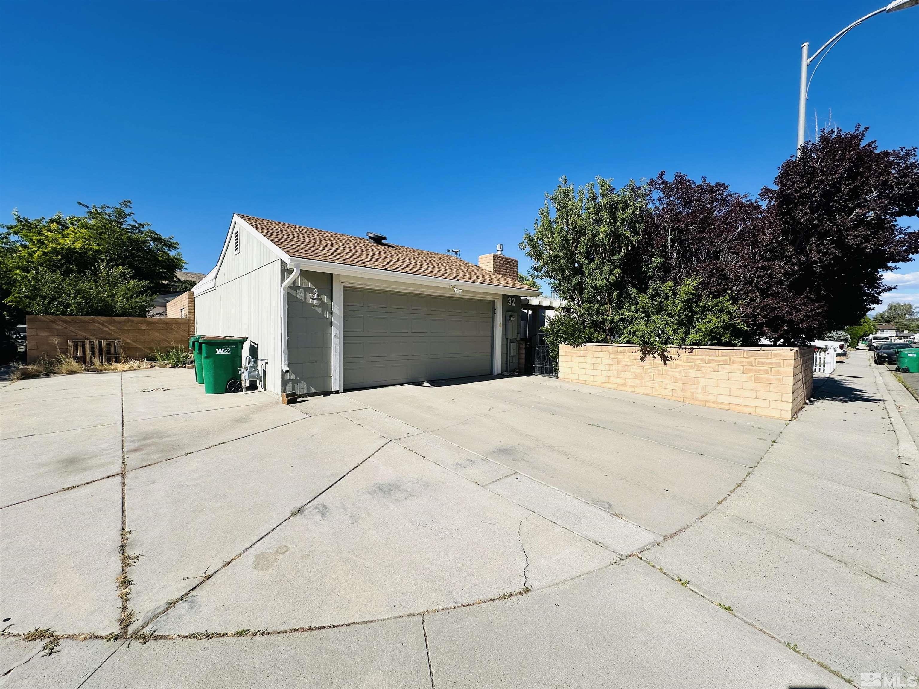 32 Castle Way Carson City, NV 89706 - Photo 16 of 16 a view of a white house with a outdoor space