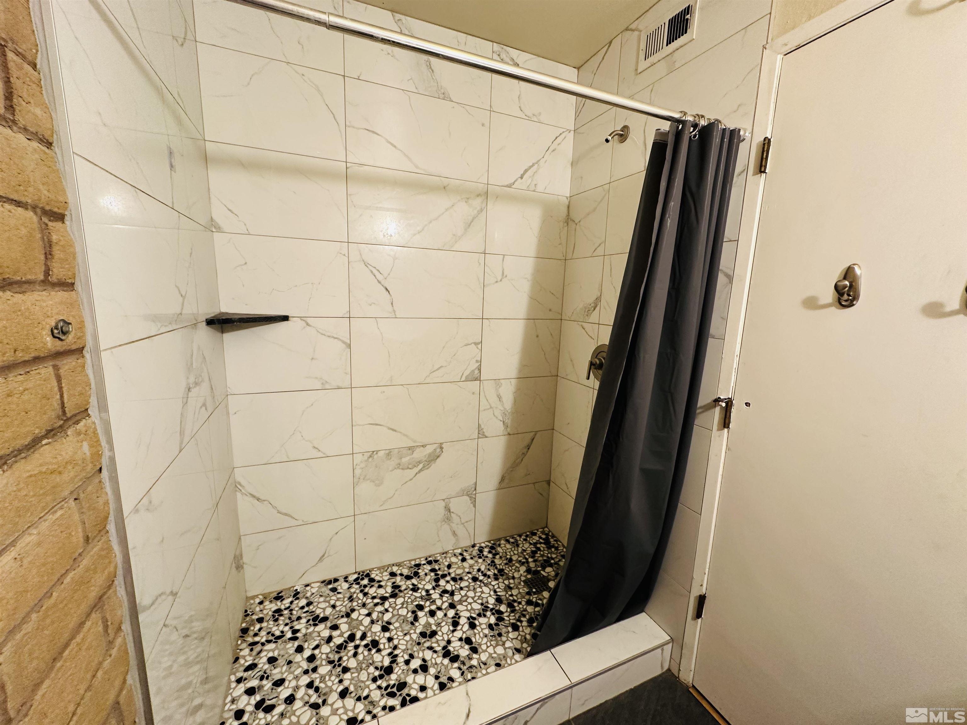 32 Castle Way Carson City, NV 89706 - Photo 7 of 16 a bathroom with a shower and a toilet