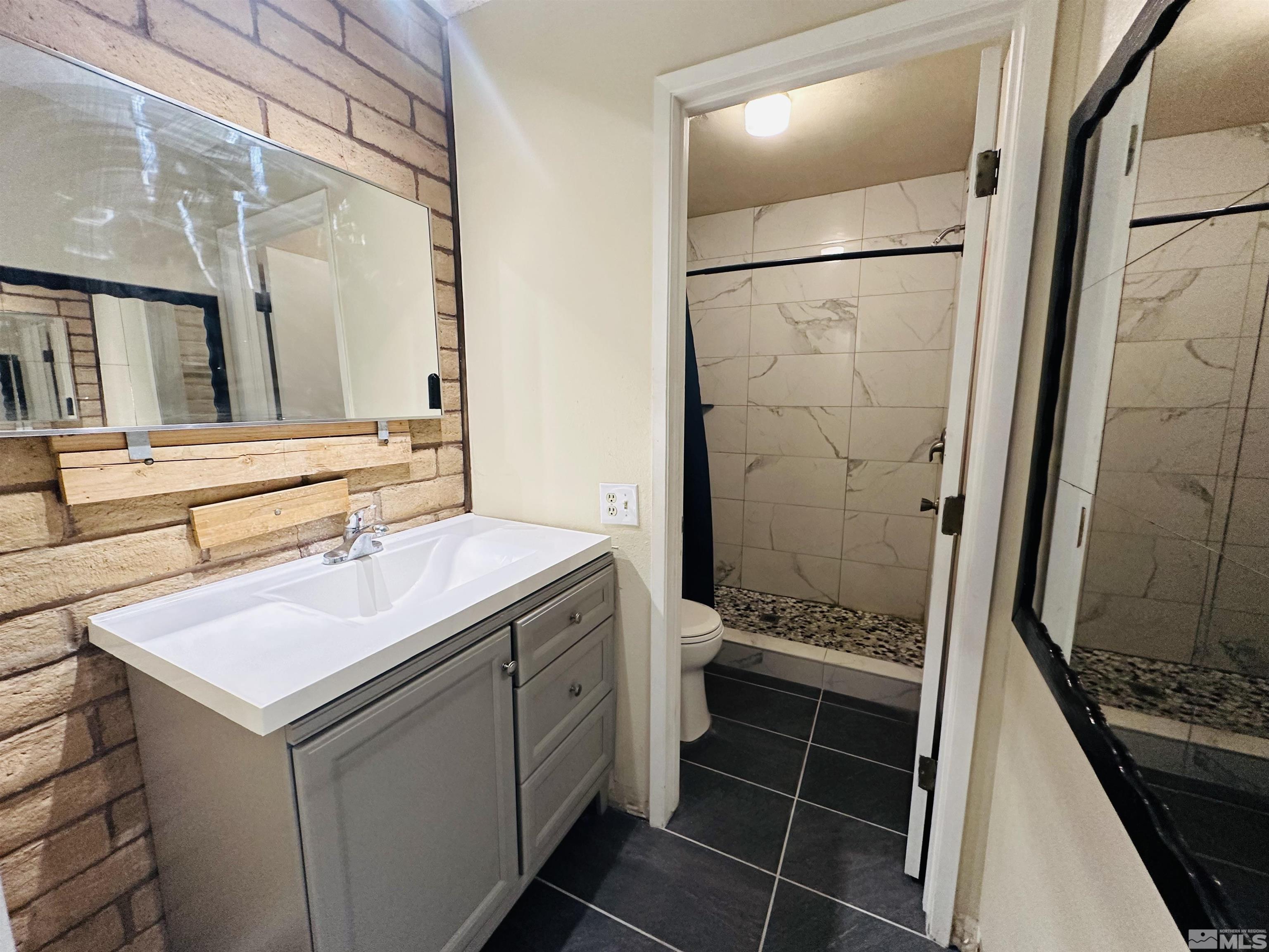 32 Castle Way Carson City, NV 89706 - Photo 10 of 16 a bathroom with a sink and a mirror
