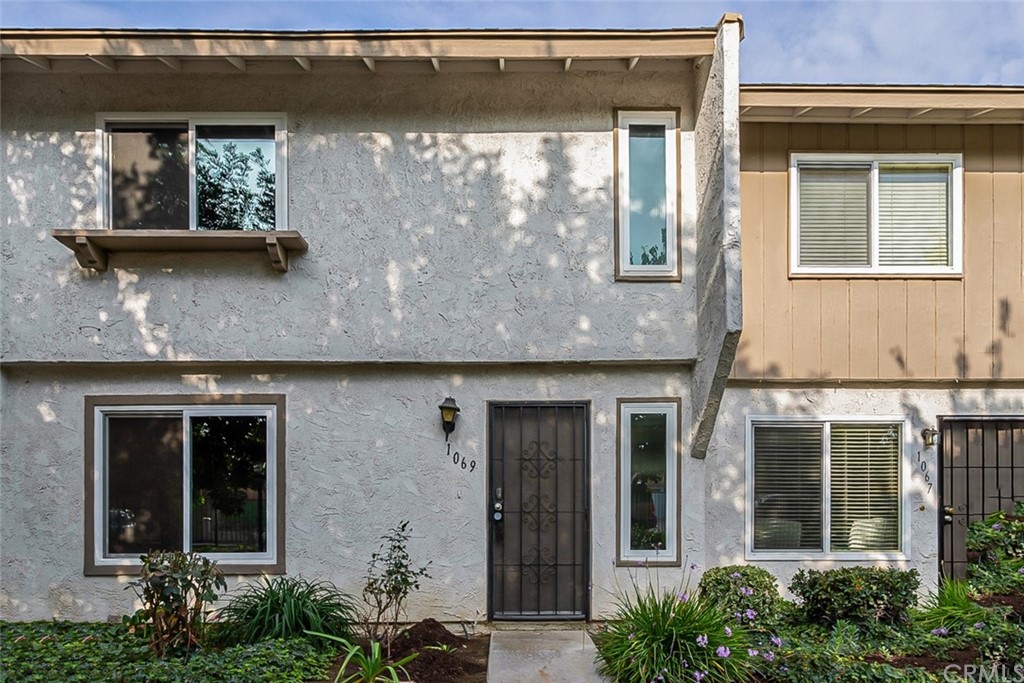1069 Clark Street Riverside, CA 92501 - Photo 1 of 1 a front view of a house with garden