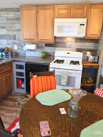 a kitchen with stainless steel appliances a stove and a refrigerator