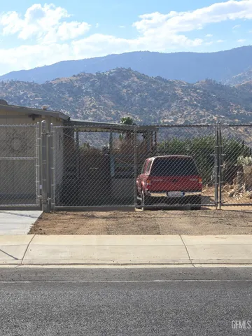 a view of a houses with a road