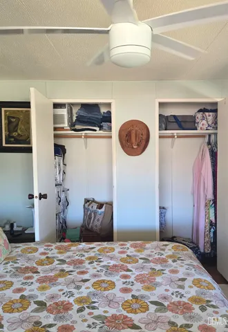 a bathroom with a sink a toilet and shower curtain