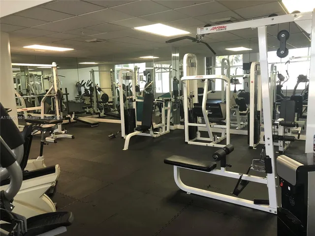 a kitchen with granite countertop a sink and a stove