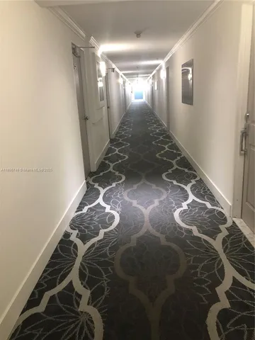 a kitchen with a refrigerator a stove and a microwave oven