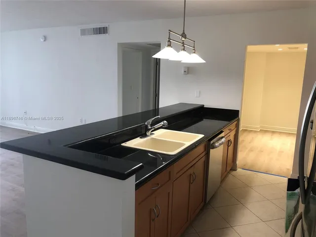 a kitchen with a stove and cabinets