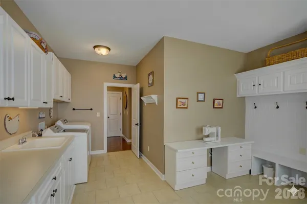 a kitchen with white cabinets