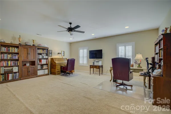 a bedroom with a bed and a lamp on table