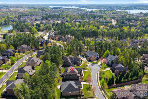 an aerial view of a house with outdoor space