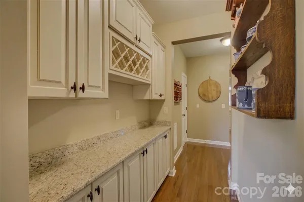 a kitchen with stainless steel appliances granite countertop a lot of counter space and cabinets
