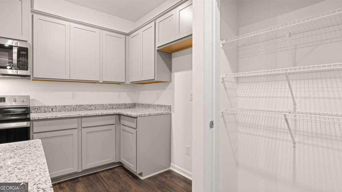 364 Sound Circle Stockbridge, GA 30281 - Photo 15 of 47 a kitchen with a sink and cabinets