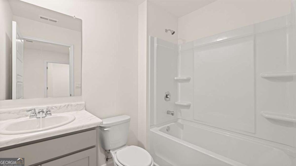 364 Sound Circle Stockbridge, GA 30281 - Photo 33 of 47 a bathroom with a sink toilet and shower