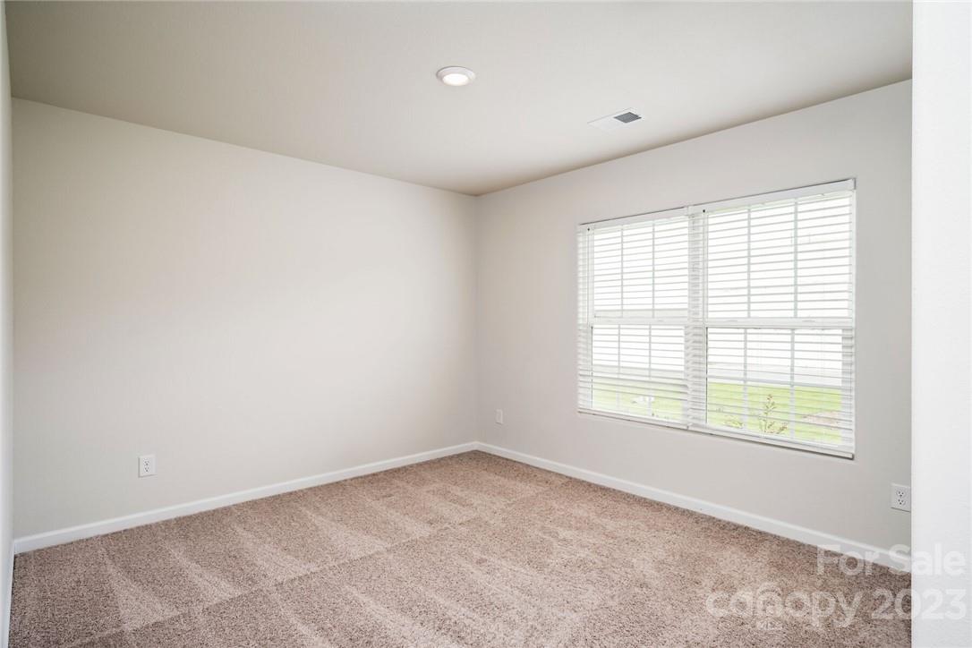 162 Brixham Loop Troutman, NC 28166 - Photo 4 of 6 an empty room with a window