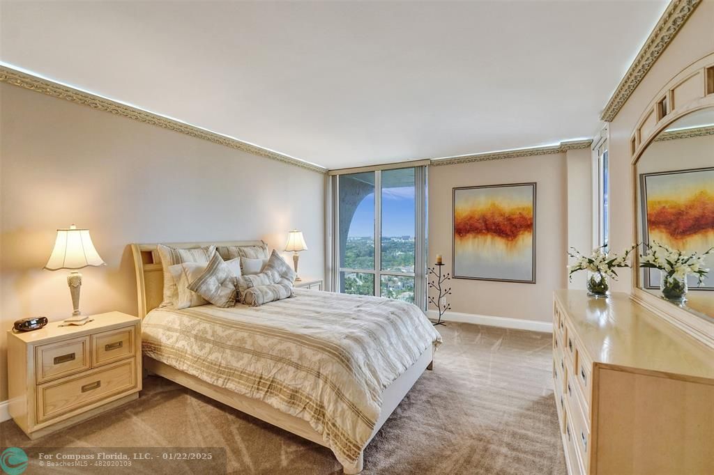 1600 South Ocean Drive, Unit 18B Hollywood, FL 33019 - Photo 11 of 36 a bedroom with a bed and a flat screen tv
