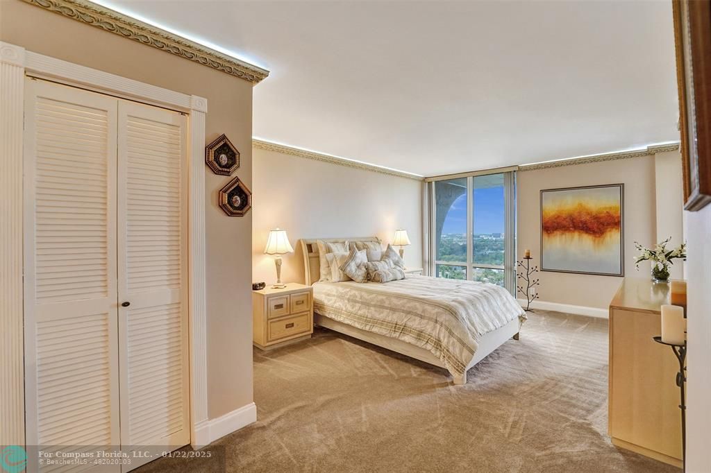 1600 South Ocean Drive, Unit 18B Hollywood, FL 33019 - Photo 12 of 36 a spacious bedroom with a bed and a window