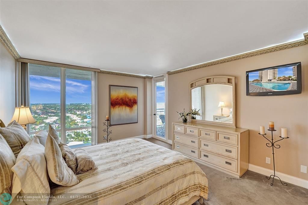 1600 South Ocean Drive, Unit 18B Hollywood, FL 33019 - Photo 13 of 36 a bedroom with a bed and a dresser