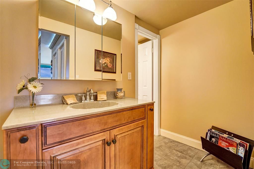 1600 South Ocean Drive, Unit 18B Hollywood, FL 33019 - Photo 15 of 36 a bathroom with a sink and a mirror