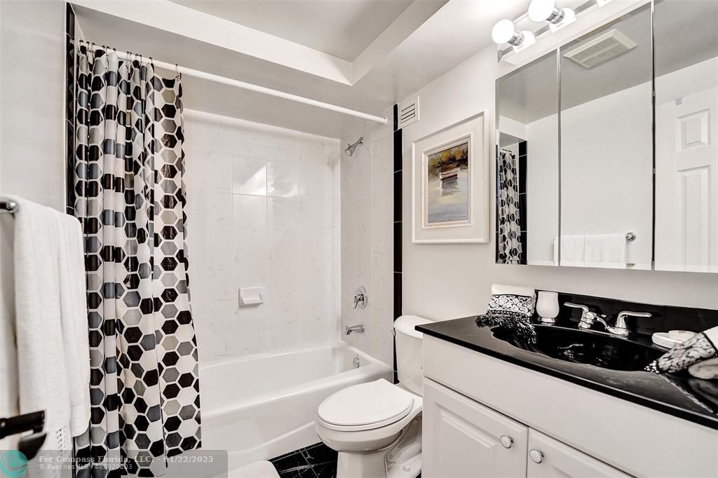 1600 South Ocean Drive, Unit 18B Hollywood, FL 33019 - Photo 19 of 36 a bathroom with a sink a toilet a shower and a mirror